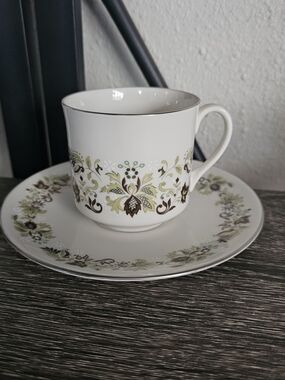 Classic White Porcelain Teacup and Saucer with Green Floral Pattern